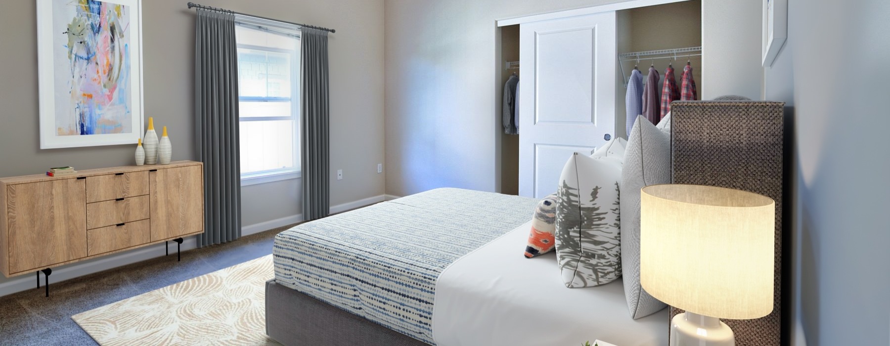 a bedroom with a bed and a lamp