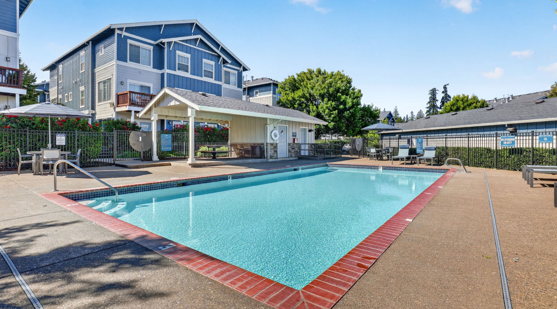 a swimming pool in front of a building