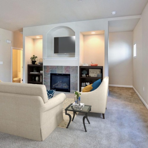 a living room with a fireplace and a couch