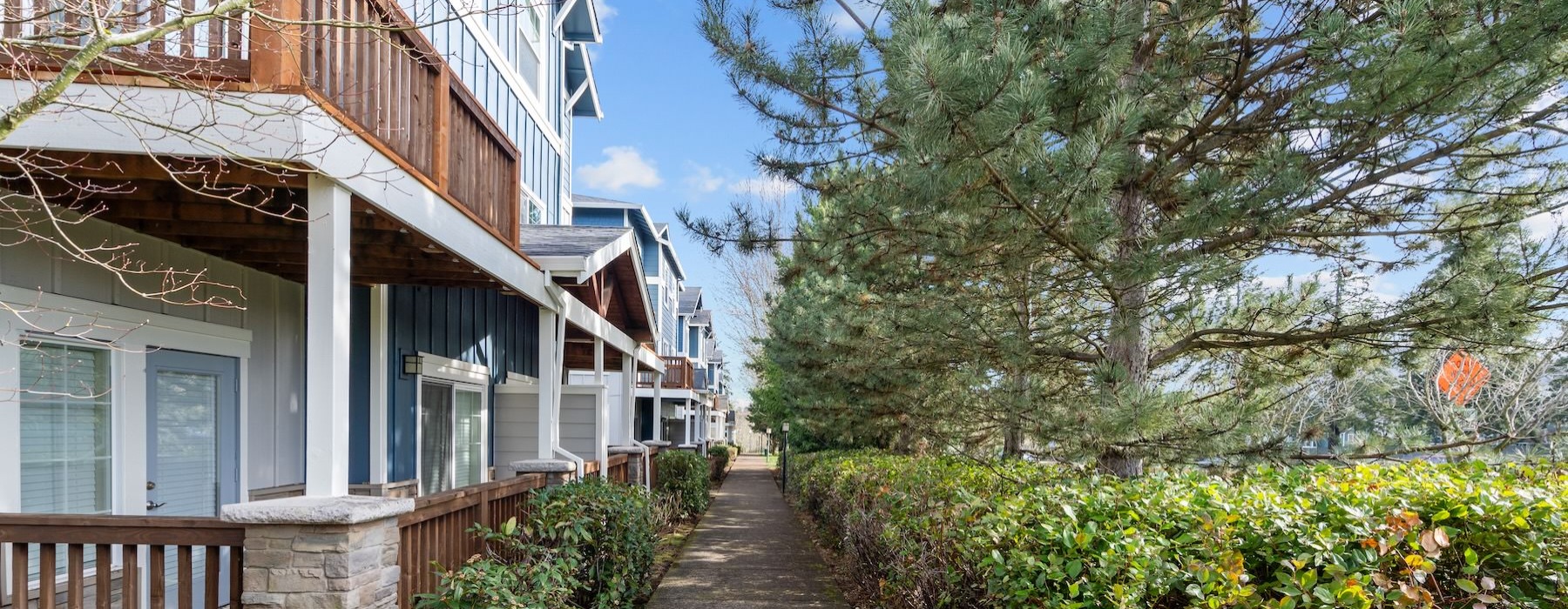 an apartment building surrounded by trees